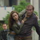 Tess and Kevin trying to escape the authorities.